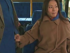 Fancy Cougar Dressed Heavily Giving A Guy Captivating Handjob In The Bus In Reality Shoot